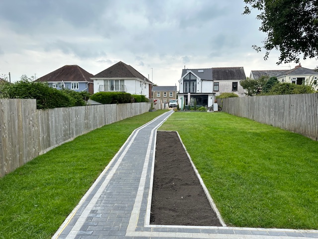 Turfing services Swansea - freshly laid lawn with neat edges and walkway